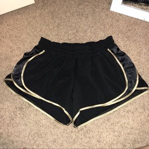 Black Lululemon Shorts with Gold Trim (size: 8/10)